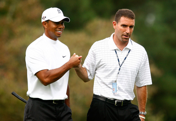 Woods seen  here  with  his  agent  Mark  Steinberg  of  IMG  Worldwide  Inc .   The  two   walked   the  course    at   East   Lake   Golf   Club  which  was  home  to the   2009  Tour  Championship  .   picture appears  courtesy  of  Getty  Images  North America  /  Scott  Halleran  ...........