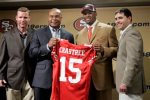 Michael Crabtree, center right, the San Francisco 49ers' first-round pick in the NFL football draft, holds up his new jersey number as he stands with 49ers coach Mike Singletary, center left, general manager Scot McCloughan, left, and president Jed York, right, during a news conference in Santa Clara, Calif., Sunday, April 26, 2009. Crabtree is a wide receiver from Texas Tech. photo appears courtesy of Associated Press/ Paul Sakuma ................